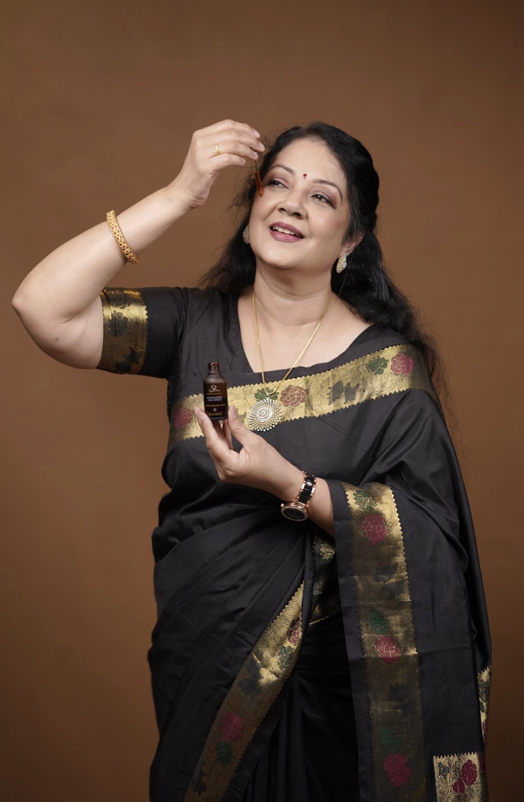 Shanthi Krishna applying SK Sundara Kayakalp Revitalizing Face Serum