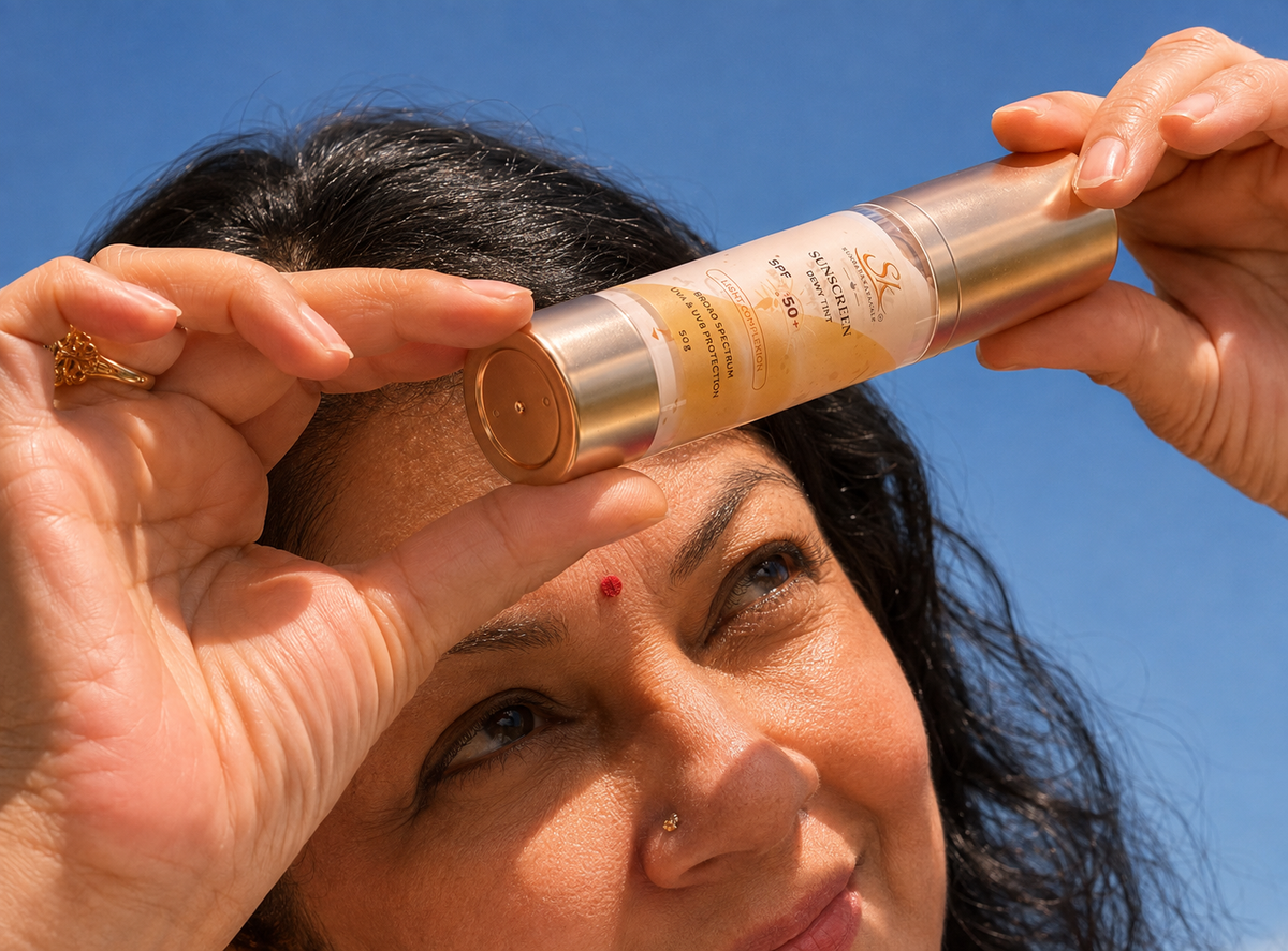 Shanthi Krishna holding Sundara Kayakalp SPF 50 Sunscreen outdoors