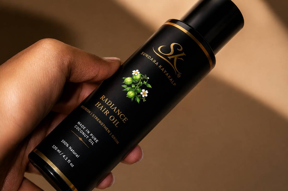 SK Sundara Kayakalp Radiance Hair Oil bottle held in hand