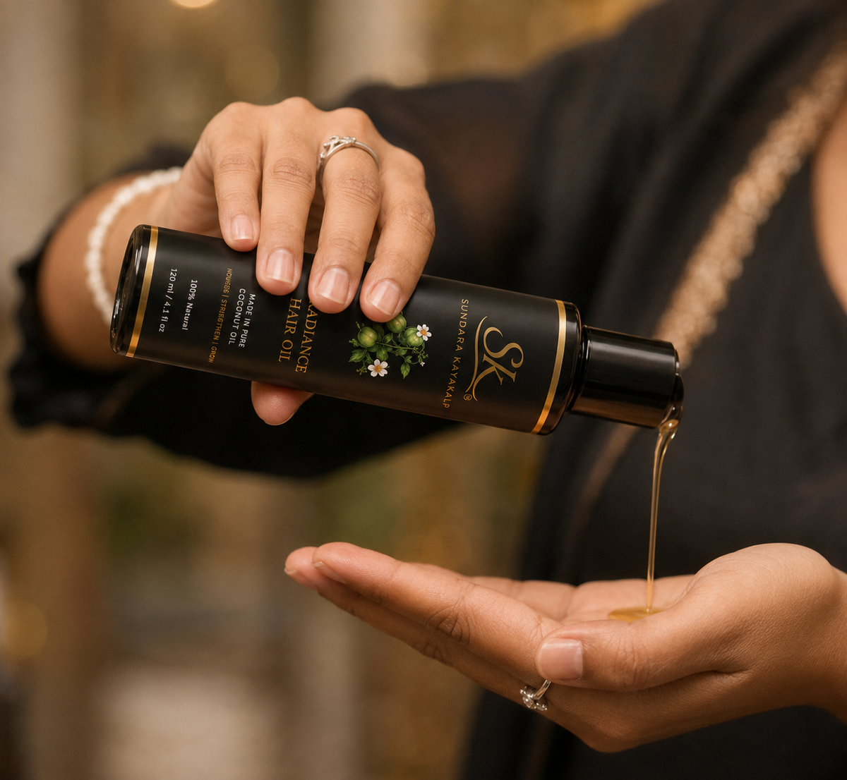 SK Sundara Kayakalp Radiance Hair Oil being poured into hand